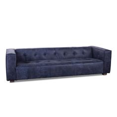 a blue couch sitting on top of a white floor