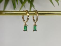 Gold plated emerald green hoop earrings Gold plated brass hoops Hoop size approximately 14mm Charm size approximately 8mm x 4mm Every order comes in our luxury matt frosted recyclable logo pouch, which are also available to purchase separately for any extra pieces you may want to store with style. Gift wrap sets (box & faux leather pouch)  are available at checkout and available to buy separately. Green Tarnish-resistant Hoop Jewelry, Green Small Hoop Earrings Tarnish Resistant, Small Hoop Green Earrings Tarnish Resistant, Green Tarnish Resistant Hoop Earrings For Gift, Green Tarnish Resistant Small Hoop Earrings, Small Hoop Green Tarnish-resistant Earrings, Small Hoop Emerald Earrings In Green, Green Emerald Small Hoop Earrings, Green Hoop Earrings For May Birthstone