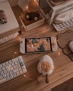 a cell phone sitting on top of a wooden table next to a keyboard and mouse