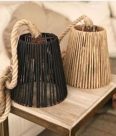 two baskets sitting on top of a wooden table