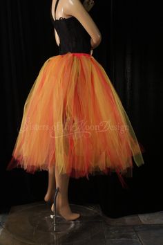 "The perfect tulle skirt for halloween or to wear all Autumn! Makes a great phoenix fire tutu for an adults halloween costume. Made in XS to Plus size This tutu skirt is handmade from 100yards of 6\" strips of tulle in Red, orange, golden yellow and copper glimmer Bridal tulle. All tulle is then tightly machine gathered, sewn and sergered to the red fabric covered elastic waistband. This tutu is fully sewn, it is not tied tulle. Tutu skirt is made to be around tea / calf length. Can be ordered f Red Fitted Skirt For Halloween, Fitted Red Skirt For Halloween, Halloween Fitted Tulle Skirt, Fitted Tulle Skirt For Halloween, Red Skirt For Halloween Cosplay, Fitted Skirt For Halloween Dance, Halloween Dance Tulle Skirt, Halloween Fitted Tutu Dress For Dance, Halloween Dance Fitted Tutu Dress