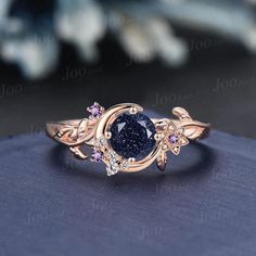 Nature Inspired Round Galaxy Blue Sandstone Amethyst Wedding Ring Unique Moon Leaf Vine Blue Goldstone Engagement Ring Art Deco Promise Ring Engagement Ring: 5mm round cut blue sandstone The side stones are 1.5mm round amethyst and moissanite Material Metal: 925 sterling silver, Solid 10k/14k/18k gold,platinum This jewelry is made to order, it can be made with any gemstone/metals. 2-3 weeks to finish. Default Shipping method is usps. 30 days non-hassle return policy.For returned items,there may Gemstone Wedding Rings Brilliant Earth, Luxury Multi-stone Crystal Promise Ring, Luxury Gemstones For Promise Rings, Cheap Crystal Promise Ring With Diamond Accents, Luxury Crystal Promise Ring With Stones, Luxury Gemstone Stackable Rings For Promise, Luxury Rings With Natural Stones For Promise, Luxury Celestial Diamond Promise Ring, Nature Inspired Wedding Ring Alexandrite