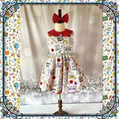 The perfect dress for back to school. Dress is made from back to school items print cotton fabric.  Handmade with love💕 Includes 1 dress and a red coordinating hair bow.  * Placement : Each dress is custom made so the pattern placement will vary for each dress. Making each dress unique.  Dresses are 100% made by me in my pet free smoke free house. Dress is crafted using 100% cotton fabric and is serged and lined for a professional finish. This dress is pictured with a red petticoat to show details. If you would like the fullness and puffiness like the picture please select the style with petticoat option. Please refer to sizing guide to make sure you are purchasing the correct size for your little girl. This dress is made to order. It will take me about 1-2 weeks to make and then ship out Playful Cotton Dresses For School, Playful Fitted Dress For School, Sleeveless Cotton School Dress, Multicolor Summer Dress For School, Multicolor Cotton School Dress, Cute Red Dress For School, Multicolor Sleeveless Dress For School, Playful Multicolor Dresses For School, Preppy Cotton Dress For Playtime