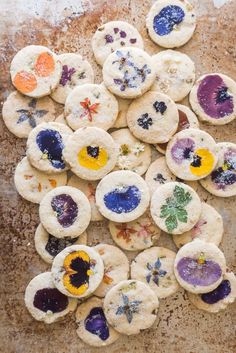 the cookies are decorated with edible flowers