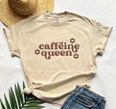 Coffee lovers unite! Are you the queen of caffeine?! Then this top is for you!  Unisex sizing  100% cotton  Puff print design Coffee Colored Cotton T-shirt Gift, Coffee Colored Cotton T-shirt For Gift, Coffee Shirt Ideas, Coffee-colored Cotton T-shirt For Gift, Cute Vinyl Shirts Women Coffee, Trendy Coffee Color T-shirt With Screen Print, Trendy Coffee-colored T-shirt With Screen Print, Trendy Coffee-colored Screen Print T-shirt, Casual Coffee Colored Slogan T-shirt