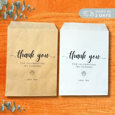 two brown and white bags with thank you written on them