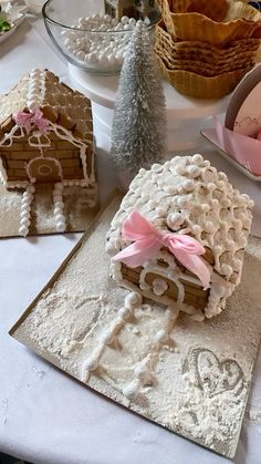 three gingerbread houses sitting on top of a table