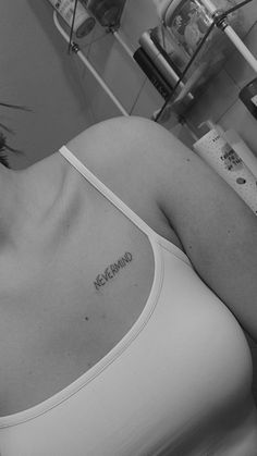 a woman with a tattoo on her chest