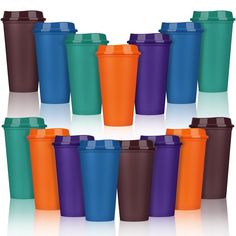 many different colored cups with lids on them