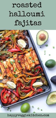 a sheet pan filled with chicken, peppers and avocado on top of a white table