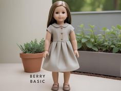 a doll is standing next to a potted plant and wearing a dress with buttons