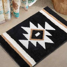 a black and white rug on the floor