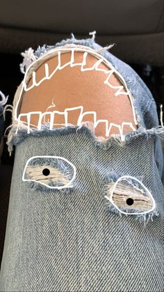 an old pair of jeans with holes in them