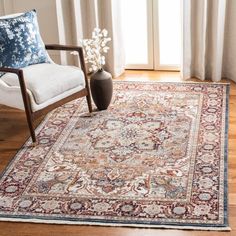 a living room area with a chair and rug