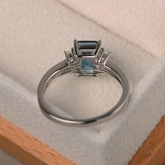 London blue topaz ring promise ring emerald cut blue | Etsy Silver Ring With Rectangular Blue Topaz, Silver Rings With Rectangular Blue Topaz, Silver Topaz Ring With Rectangular Blue Stone, Silver Blue Topaz Ring With Rectangular Stone, Elegant Blue Topaz Asscher Cut Ring, Emerald Cut Cubic Zirconia Topaz Ring With Halo Setting, Emerald Cut Topaz And Diamond Promise Ring, Modern Silver Topaz Ring With Emerald Cut, White Gold Blue Topaz Baguette Cut Ring