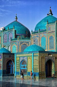 an elaborately decorated building with blue domes