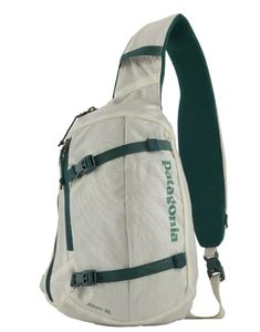 a white backpack with green straps on the front and side pockets, sitting against a white background