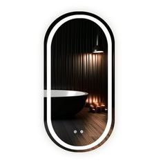 an oval mirror reflecting a bathtub in the middle of a room with candles around it