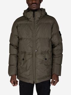 The Stone Island Crinkle Reps Hooded Down Jacket is more than just a garment - it's a statement piece that embodies innovation, sustainability, and timeless design.
Crafted from 100% recycled nylon, this jacket is a conscious choice for the fashion-forward individual. Experience superior warmth and comfort with ethically sourced down filling. The unique garment-dyeing process creates a captivating crinkled finish, making each jacket a one-of-a-kind piece.
  100% Recycled Nylon Outer
 RDS Certifi Green Down Puffer Jacket With Padded Collar, Green Down Puffer Jacket With Pockets, Green Down Outerwear With Detachable Hood, Green Down Outerwear With Padded Collar, Urban Green Puffer Jacket With Pockets, Green Hooded Outerwear With Padded Collar, Boot Pumps, Mm6 Maison Margiela, Stone Island