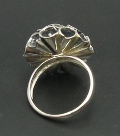 Sterling silver ring 925/1000, flower. Stamped 925. Approximate weight 14.0 grams. Top width 2.4cm. All our jewels are made from solid sterling silver 925/1000 and are carefully crafted by hand in our family workshop. We dispatch your orders in 5 working days, worldwide and the postage is $5. We ship registered priority mail. Please allow 5-7 working days for delivery in Europe and 10-15 working days outside Europe. For any questions - please do not hesitate to contact me! Silver Open Ring Flower Design For Anniversary, Sterling Silver Concave Dome Ring As Gift, Elegant Silver Flower Ring Stamped 925, Silver Filigree Ring With Polished Finish As Gift, Unique Silver Flower Shaped Ring, Silver Engraved Flower Ring Gift, Elegant Handmade Silver Dome Ring, Formal Hallmarked Flower Shaped Ring, Silver Hallmarked Dome Ring Fine Jewelry