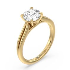 a yellow gold engagement ring with a round diamond