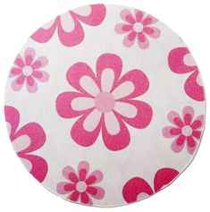 a pink and white flower pattern on a round surface