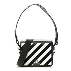 This is an authentic OFF-WHITE Saffiano Striped Diag Binder Flap Bag Black and White. This tote is crafted of grained saffiano black and white leather. The bag features a black leather trim, a grey strap with the wording "off-white" embroidered on it, and polished dark silver hardware. The top is open to a black interior with a zipper and patch pocket. Off White Bags, White Shoulder Bag With Palladium Hardware For Office, White Saffiano Leather Office Bag, Classic White Saffiano Leather Shoulder Bag, White Saffiano Leather Bag For Everyday Use, Evening White Saffiano Leather Bag, White Travel Bag With Striped Lining, White Bags With Striped Lining For Daily Use, White Saffiano Leather Evening Bag