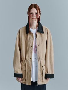 This is MARGESHERWOOD’s work jacket features a loose-fitting oversized silhouette made from Oxford fabric. Denim accents on the collar and cuff add detail to the design. The collar can be worn up using the collar button detail. After production, a post-process stone washing adds a natural vintage mood to the stitching and seam areas. The internal waist string allows for various silhouette adjustments. It can be worn open with a front zipper closure and pocket snap buttons. The sleeve seam details allow for voluminous sleeves. With its generous size, it can be worn by both men and women.- Ideal for daily wear- Can be paired with different styles to create various looks- The brand logo is embroidered on the square outer pocket, adding a focal point to the look Spring Utility Jacket With Corduroy Collar For Work, Classic Beige Outerwear With Corduroy Collar, Khaki Utility Jacket With Corduroy Collar For Work, Spring Utility Jacket With Corduroy Collar, Beige Oversized Utility Outerwear, Spring Cotton Outerwear With Contrast Collar, Utility Beige Outerwear For Streetwear, Oversized Spring Outerwear With Corduroy Collar, Beige Utility Outerwear For Streetwear