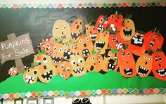 a bulletin board with pumpkins for sale on it