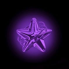 a shiny purple star on a black background