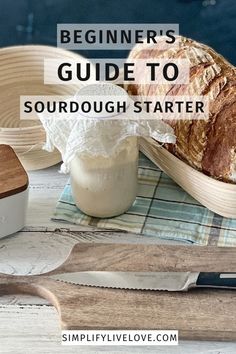 the beginner's guide to sourdough starter is on display with bread and butter