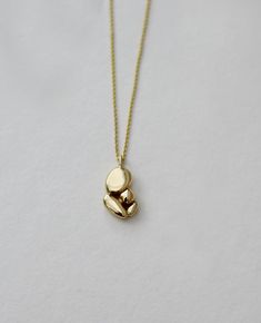 Minimalist 14k gold necklace - this is an abstract solid gold pendant necklace. This modern necklace is an originalhandmade solid gold jewelry piece that will upgrade every outfit with a unique touch.  "Mama's hug" necklace is a peaceful and meaningful pendant that holds those emotions of a mother's hug, love & security I've been back and forth working on this pendant for nearly two years, knowing that this would be a meaningful necklace to wear for life. And it turned out to be my favorite piec Gold Pendant Necklace Unique, Minimalist Polished Brass Necklaces, Minimalist Recycled Gold Pendant Necklace, Minimalist Yellow Gold Necklace In Recycled Gold, Modern Yellow Gold Necklace In Recycled Gold, Modern 14k Gold Pendant Necklace, Minimalist 14k Gold Pendant Necklace, Hug Necklace, Lost Wax Jewelry