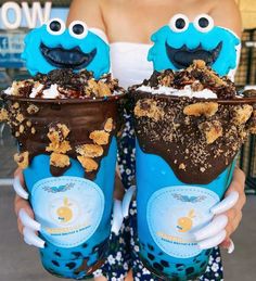 two ice cream sundaes decorated to look like sesame street characters