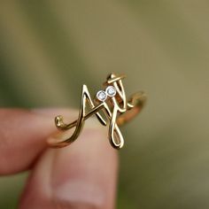 "Beautiful handcrafted 14k Solid Gold name ring. This lovely custom made ring is a perfect accessory to own or gift - for your wife, best friends, brothers, sisters and all of your loved ones :) Important dates/coordinates can also be made. We will send a drawing before starting the manufacturing process so you know what it will look like. * Diamond Color-Clarity Grade : H-I, Vs-Si * Gold - 14k Solid Gold SENDING AS A GIFT We would be happy to send your gift directly to the recipient, including Personalized Diamond Initial Ring For Wedding, Fine Jewelry Diamond Initial Ring As Gift, Diamond Engraved Ring With Initials For Gift, Diamond Engraved Ring With Initials As Gift, Heirloom Diamond Initial Ring As Gift, Heirloom Diamond Initial Ring Gift, Spiritual 14k Gold Engraved Wedding Ring, Diamond Initial Ring In Yellow Gold, Diamond Initial Ring As A Gift