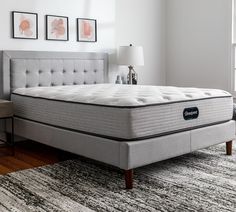 an image of a mattress on the floor in a room with white walls and carpet