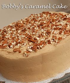 there is a cake with nuts on it and the words baby's caramel cake