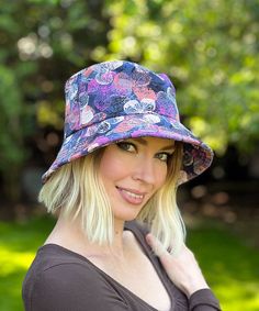 THE HOLLIE, handmade in Seattle, WA, USA, is a great, structured hat with a firm yet flexible brim. This hat is shown in Assorted Cotton Prints. The brim is 3.25" at the center front and 3" on the sides of the hat. The crown height is 4". The top of the crown is oval shaped, measuring 7" from side seam to side seam and 7.375" from front to back. Available in our easy to match linen fabrics. With a nice wide brim, no matter how hard the sun shines, it won't stop you from being stylish in this hat Reversible Festival Hat One Size, Festival Reversible Sun Hat With Curved Brim, Reversible Short Brim Festival Sun Hat, Adjustable Short Brim Bucket Hat For Garden Party, Reversible Wide Brim Hat For Festivals, Wide Brim Reversible Hat For Festivals, Adjustable Bucket Hat For Garden Party, Multicolor Short Brim Hat For Garden Party, Reversible Multicolor Brimmed Hat