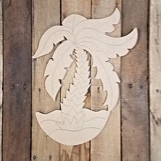 a wood carving of a flower on a wooden wall with planks in the background