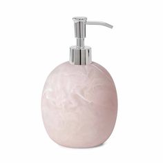 a soap dispenser with a pink marble finish and chrome faucet