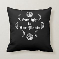 a black pillow with the words sunlight is for planets on it