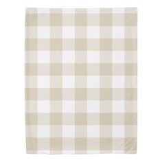 a beige and white checkered blanket on a white background