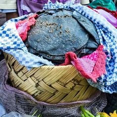 a basket filled with lots of different types of cloth