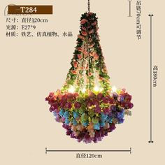 a chandelier with flowers hanging from it's side and measurements in chinese