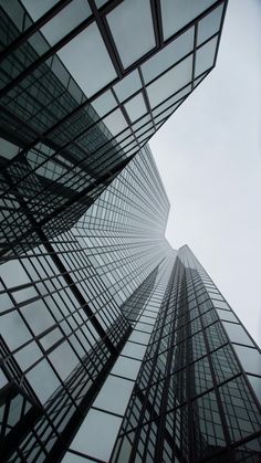 looking up at tall buildings from the ground