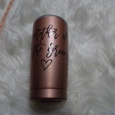 a can with writing on it sitting on top of a white furnishing area