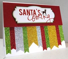 a santa's coming card made with glitter