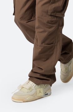 Articulated knees emphasize the baggy, relaxed fit of cargo pants that are cut from soft cotton and fitted with plenty of pockets for stowing a day's essentials. 32 1/2" inseam; 9 1/2" leg opening Zip fly Front pockets; back pockets; cargo flap-patch pockets 100% cotton Machine wash, tumble dry Imported Beige Cargo Jeans With Patch Pockets For Streetwear, Beige Cargo Jeans With Side Pockets For Streetwear, Urban Straight Leg Cargo Pants, Beige Parachute Pants With Hip Pockets For Streetwear, Beige Baggy Cargo Jeans For Streetwear, Beige Multiple Pocket Cargo Jeans For Streetwear, Relaxed Fit Cargo Pants With Patch Pockets For Streetwear, Beige Cargo Jeans With Multiple Pockets For Streetwear, Streetwear Tapered Leg Parachute Pants With Patch Pockets