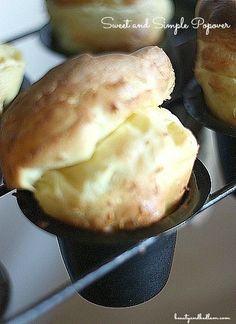 several muffins sitting on top of a metal rack