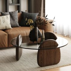 a living room filled with furniture and a glass top table in front of a window