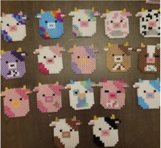 cross stitch pictures of farm animals are arranged on a table with the numbers one and two